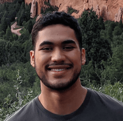Esteban Chirinos smiling on a hike